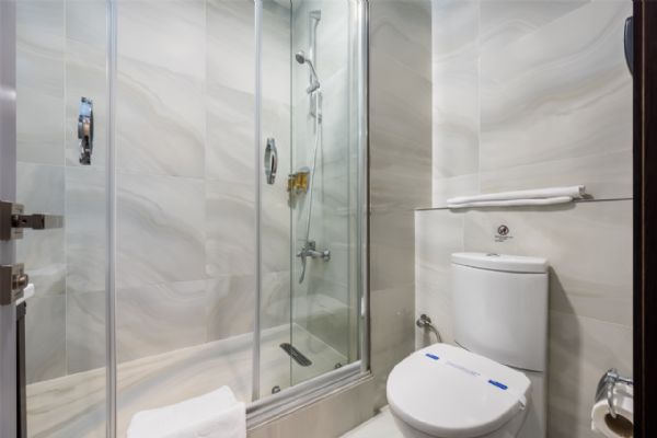 Bathroom With Hairdryer And Scale