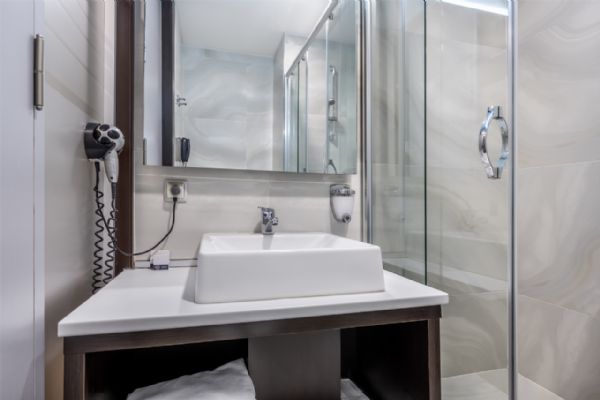 Bathroom With Hairdryer And Scale